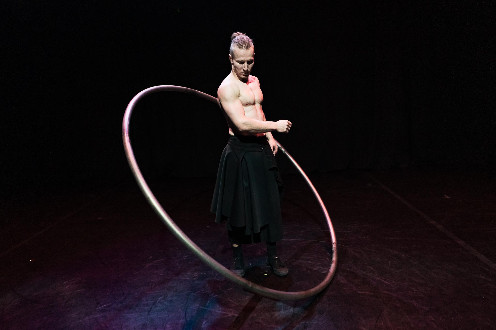 Cyr Wheel - acrobat with metal monocycle